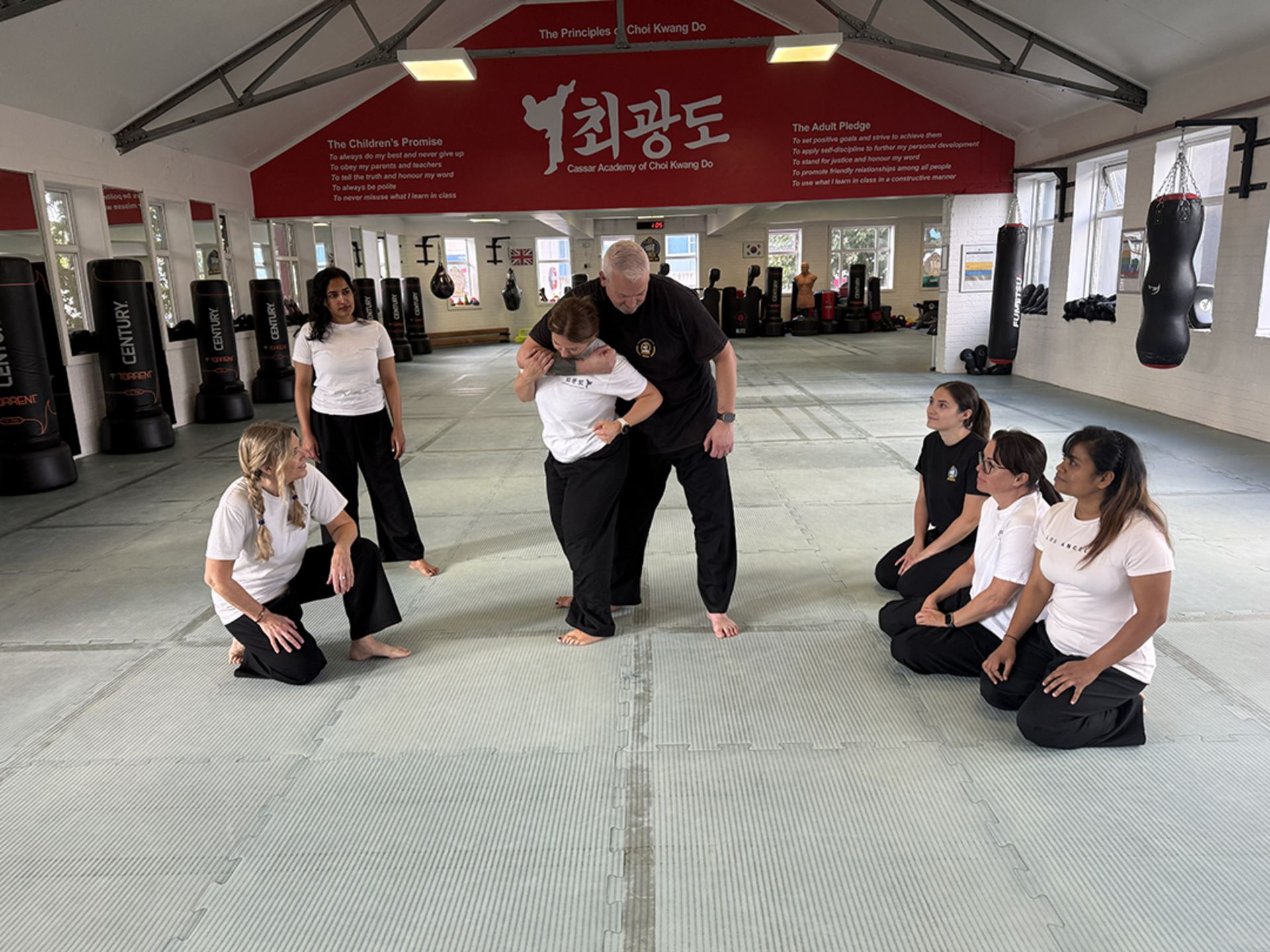 Women's self-defence workshop at Cassar Academy: rear choke demonstration