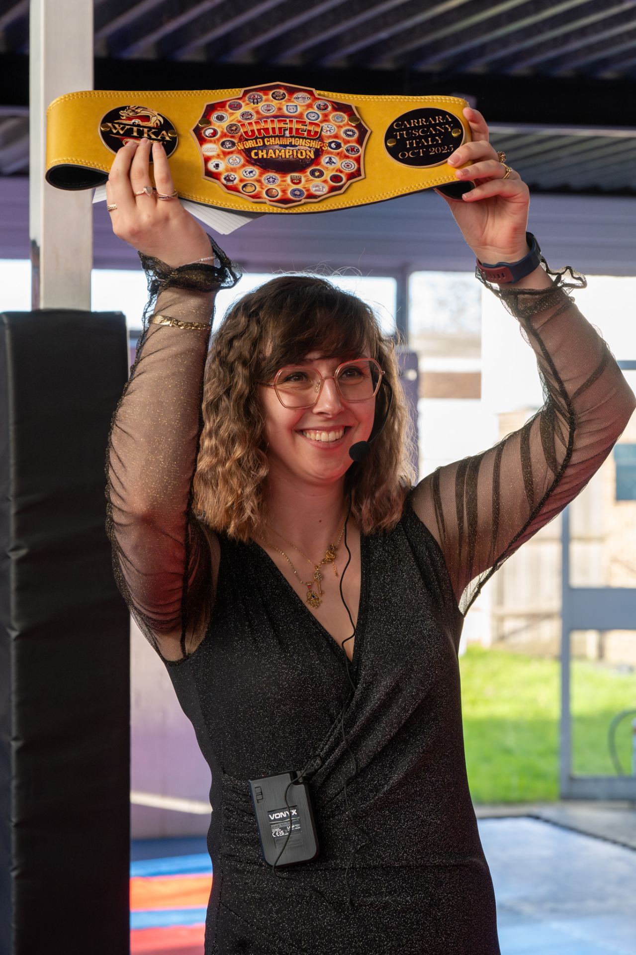 Kirsten Owen with the WTKA Unified World Champion belt