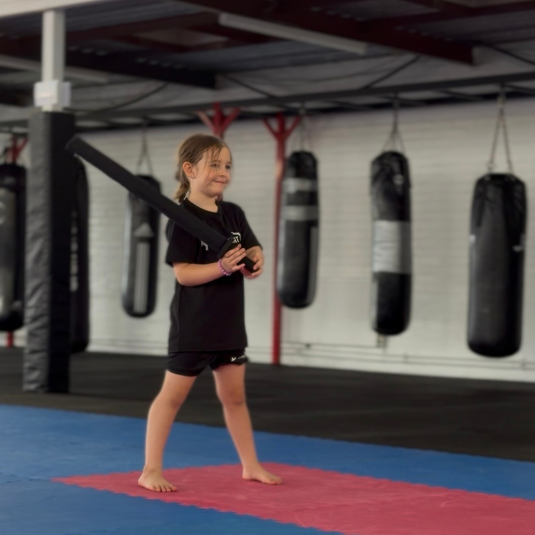 Young beginner with a foam practice sword