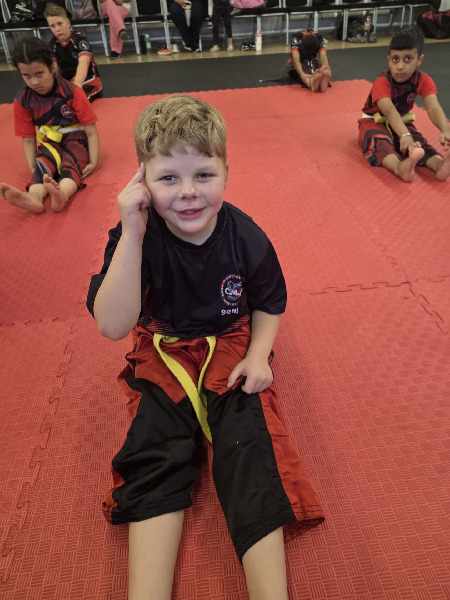Young student in CMA squad kit during class