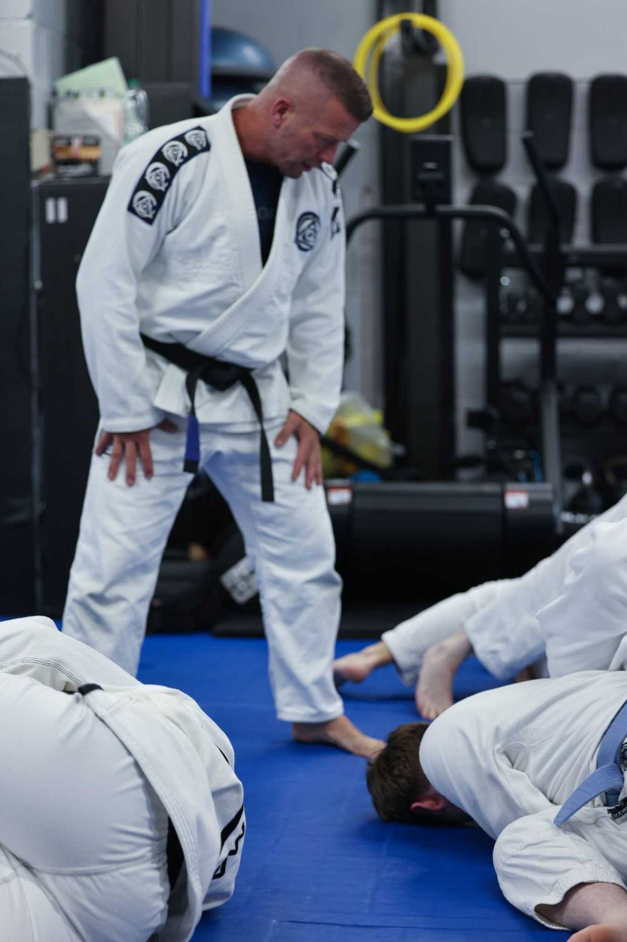 Instructor Chris Pritchard coaching a Brazilian Jiu Jitsu class on the mats